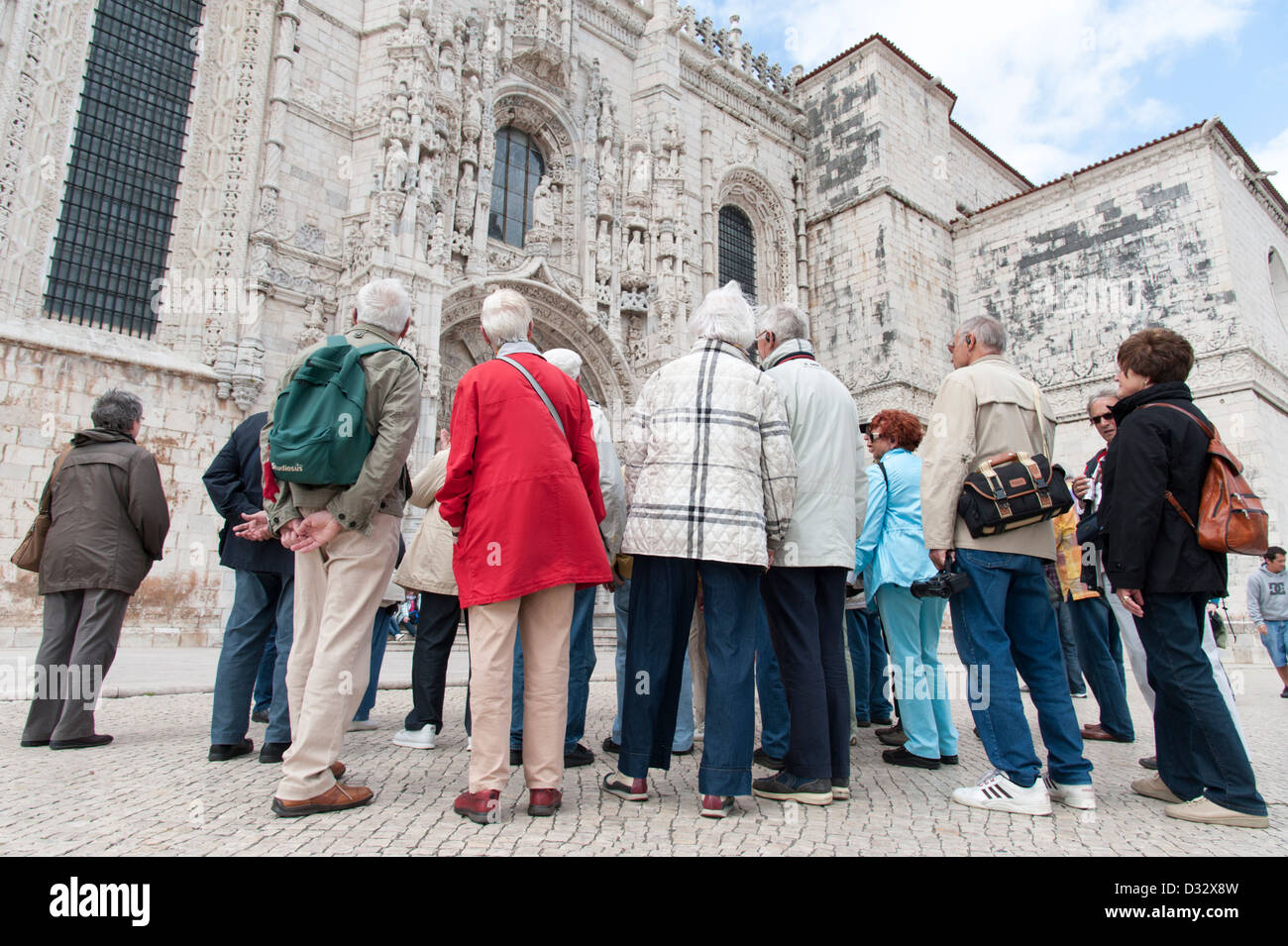 Group of elderly German tourists on a guided tour visiting the Jeronimos Monastery, Lisbon, Portugal Stock Photo