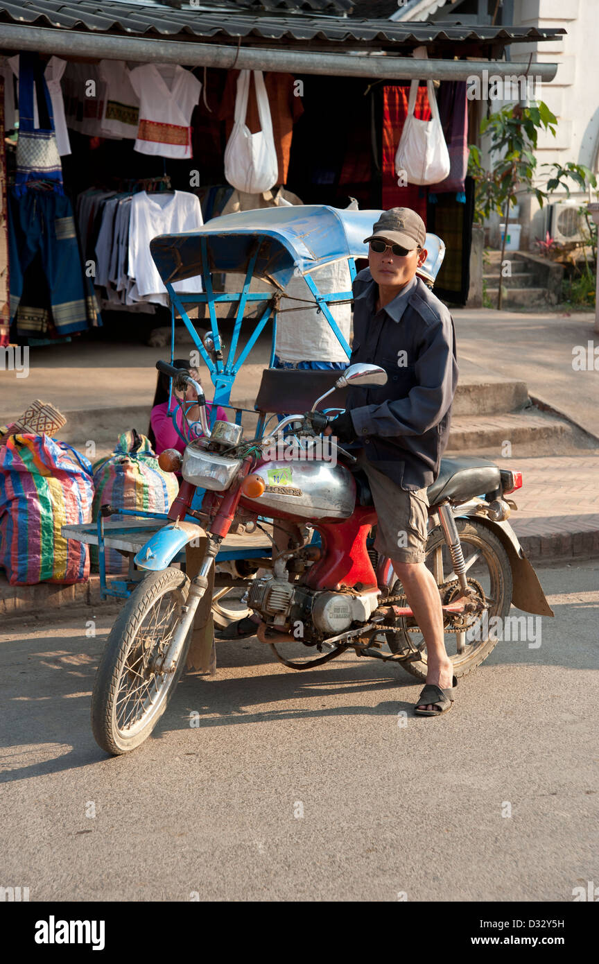 Motorbike taxi and rider in Luang Prabang Laos Stock Photo