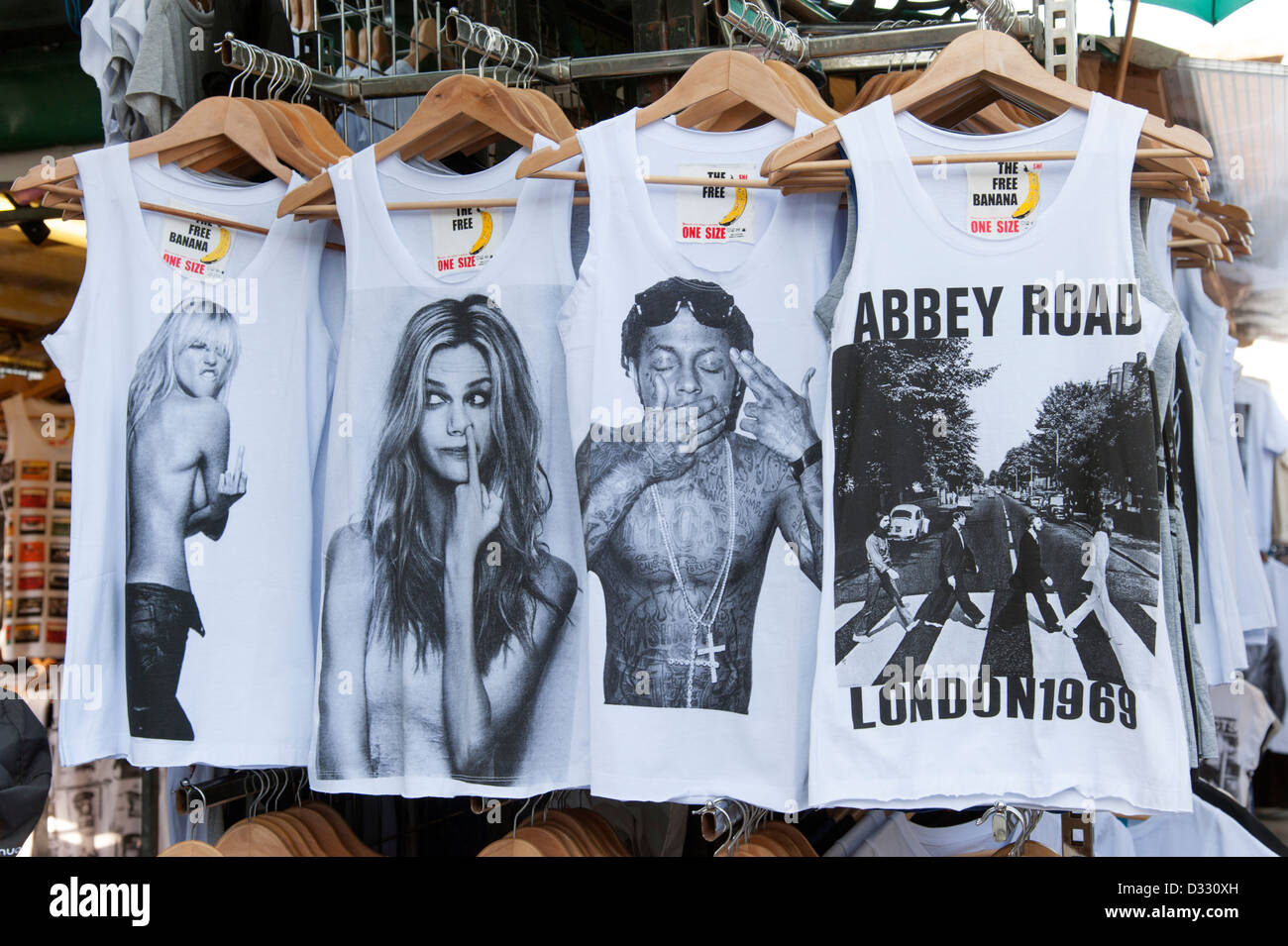 Trendy printed T shirts showing famous people for sale on Camden Market stall, London, England, UK Stock Photo