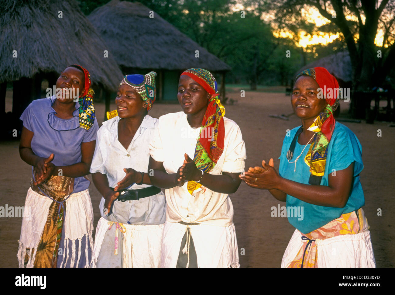 4, four, Zimbabwean women, African women, singing, handclapping, hand