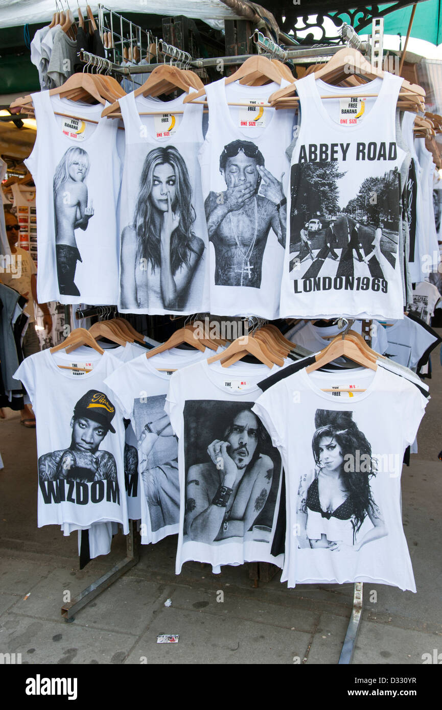 Trendy printed T shirts showing famous people for sale on Camden Market stall, London, England, UK Stock Photo