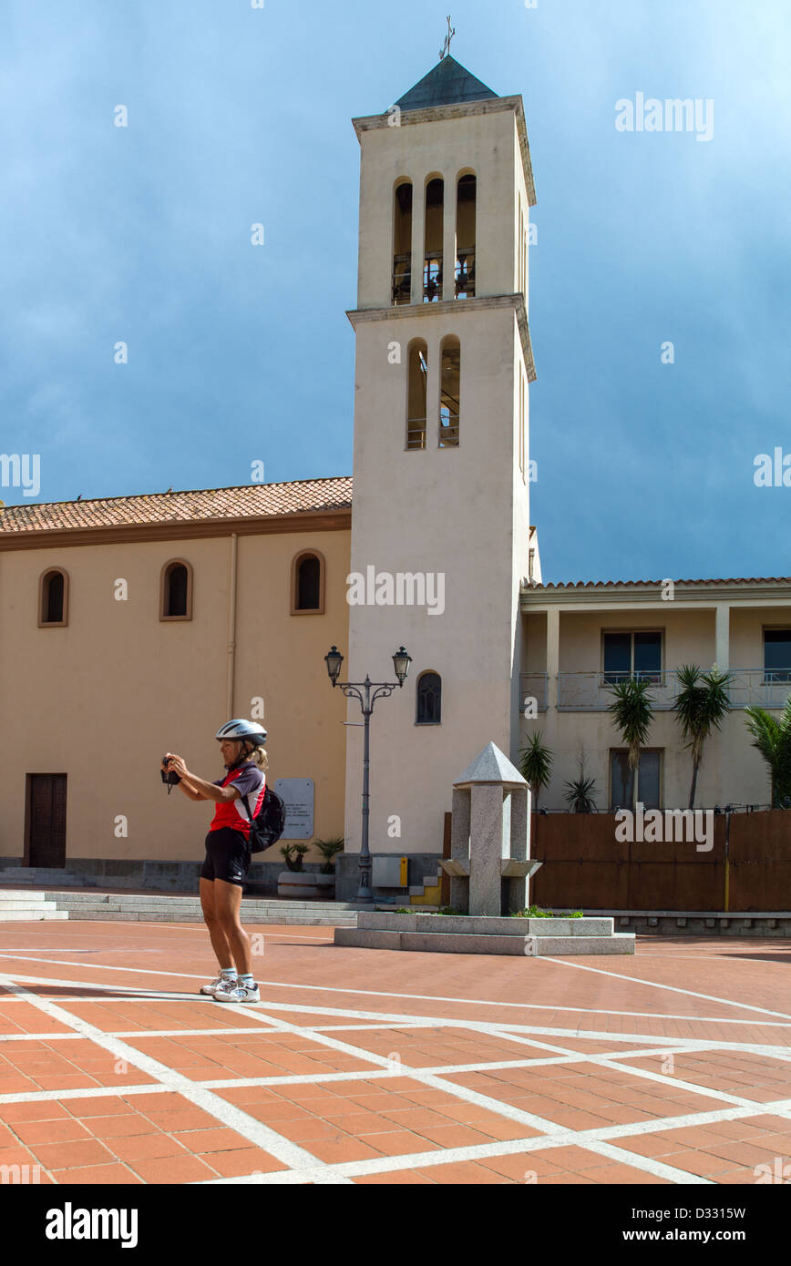 Italy, Sardinia, San Teodoro, a tourist in the village main square Stock Photo