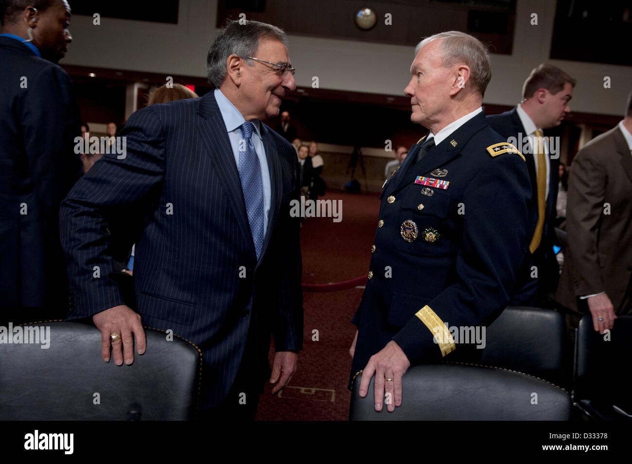 Washington DC, USA. 7th February 2013. US Defense Secretary Leon Panetta and Joint Chiefs General Martin Dempsey talk before a hearing of the Senate Armed Services Committee on the Defense Department’s response to the attack on the US Consulate in Benghazi, Libya February 7, 2013 in Washington, DC. Credit:  Planetpix / Alamy Live News Stock Photo