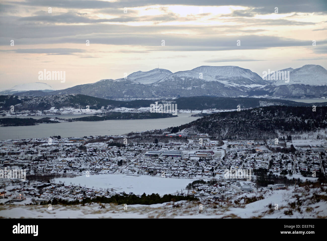 Scenic aerial view of view of Alesund (Norway) with snow capped mountains at winter. Stock Photo