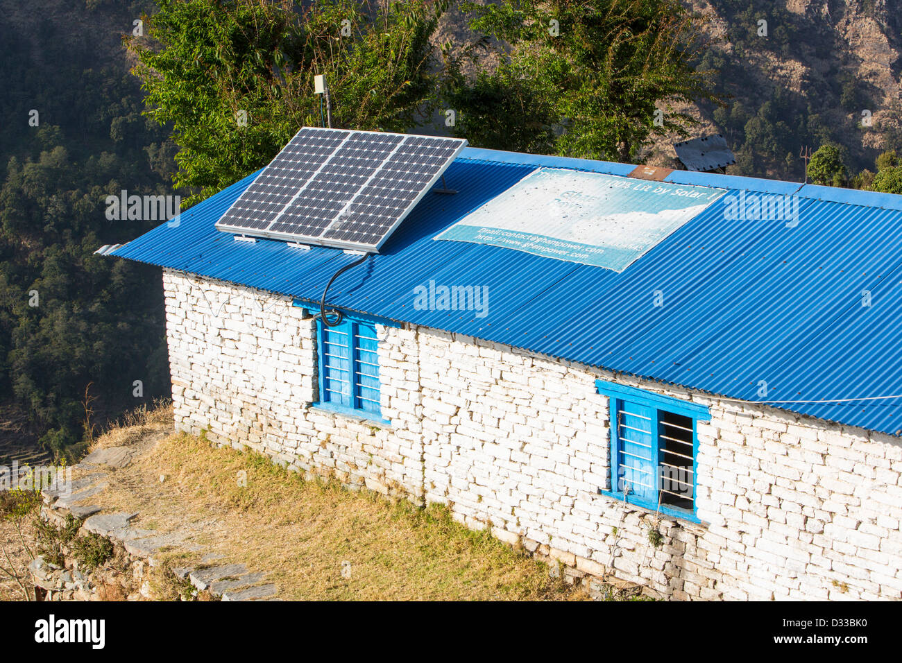 Solar photo voltaic panels on the rooftops of a school in Ladruk in the Himalayan foothills, Nepal. Stock Photo