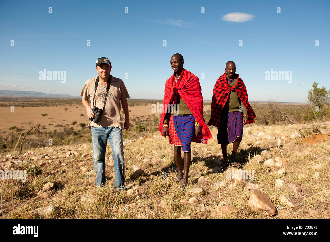 Walking safari with Masai guides, Maasai Mara National Reserve, Kenya Stock Photo