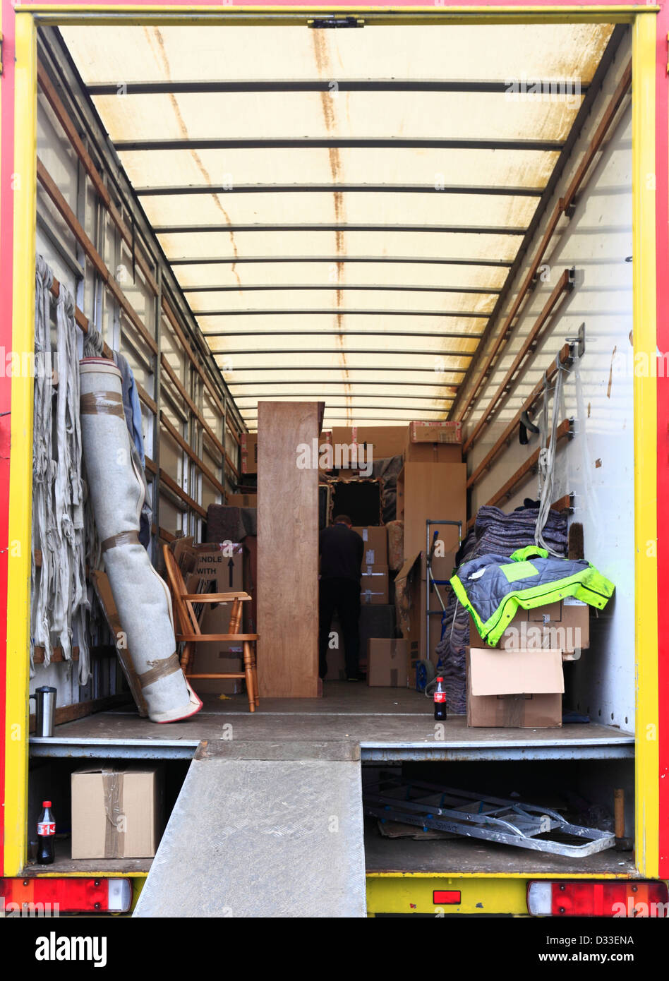 Looking into the back of a removal van part way through being filled for a house move. Stock Photo