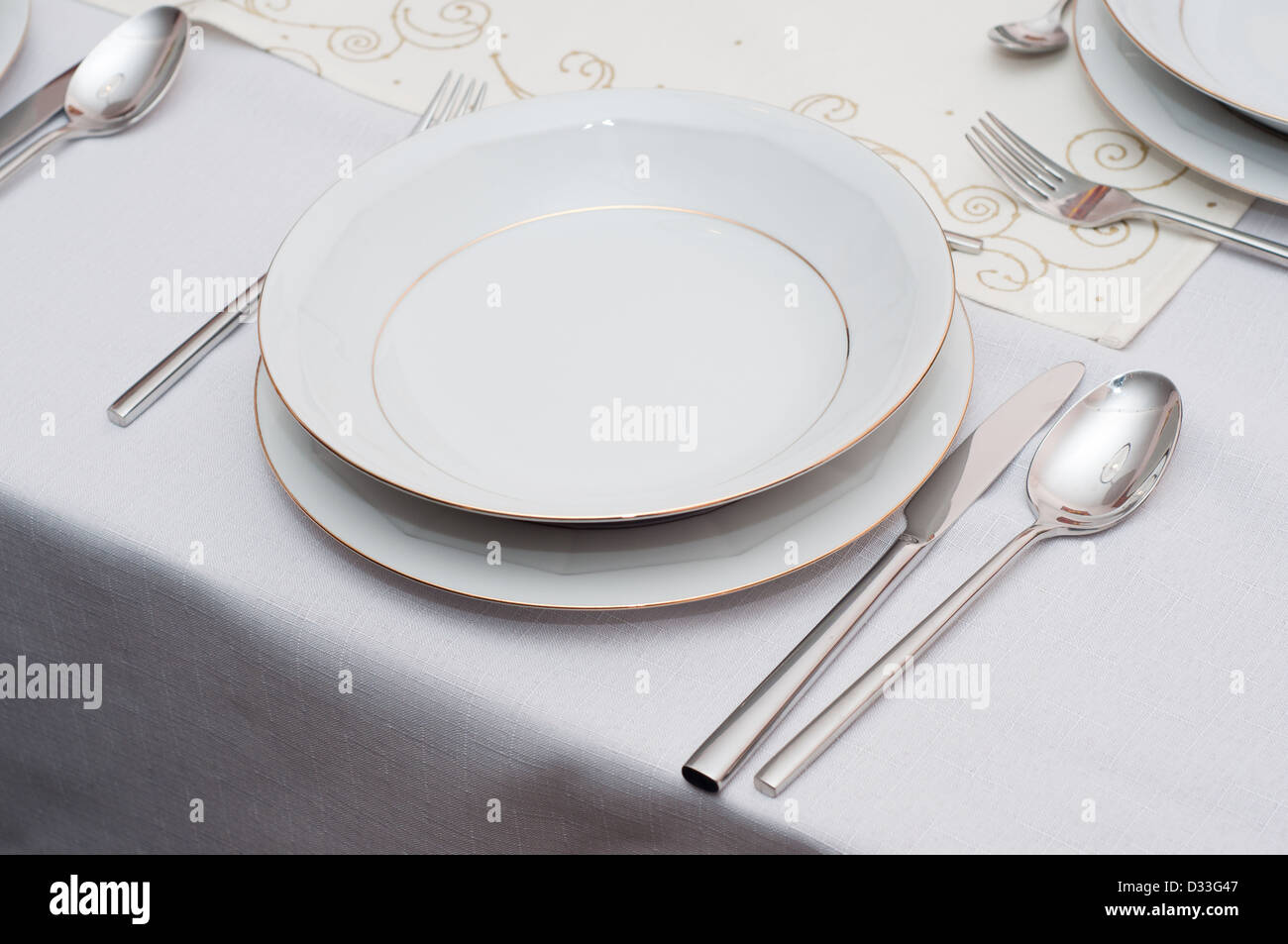 table with white porcelain plate. Stock Photo