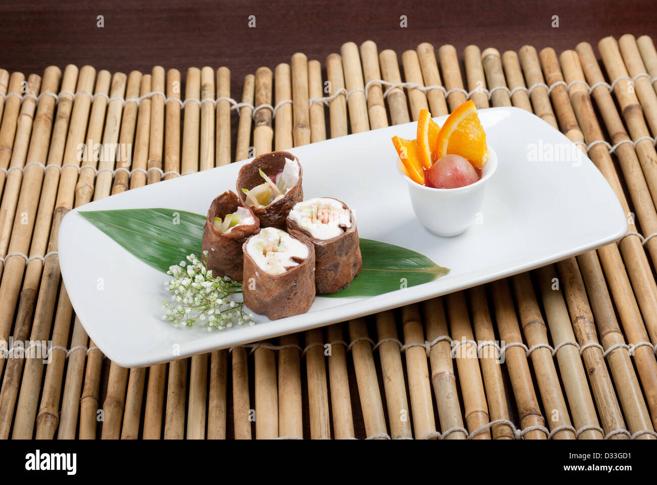 Dessert Maki Sushi - Chocolate Roll with Various Fruit and Cream Stock  Photo - Alamy