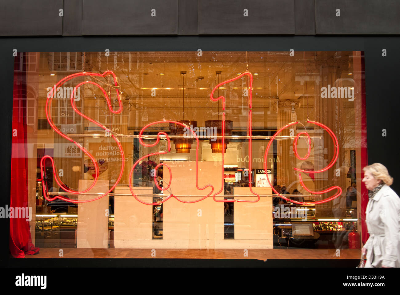 neon sale sign in department store window Stock Photo