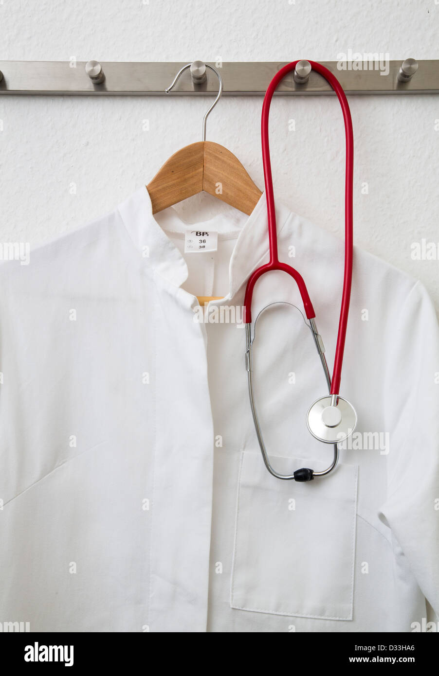 Lab coat and stethoscope hanging on a coat rack Stock Photo Alamy