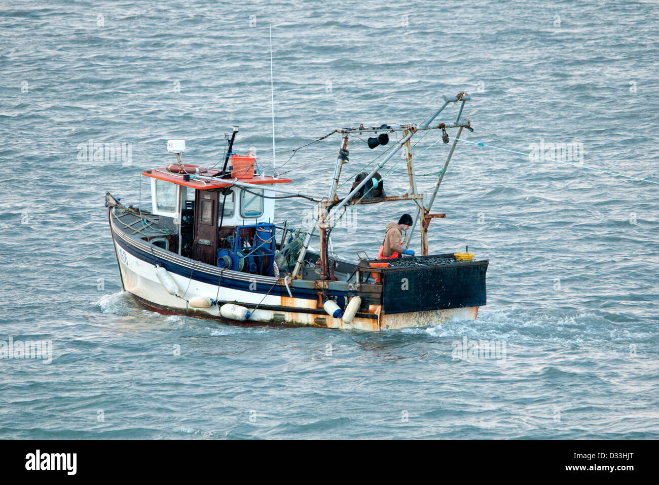 small fishing boat trawling Stock Photo - Alamy