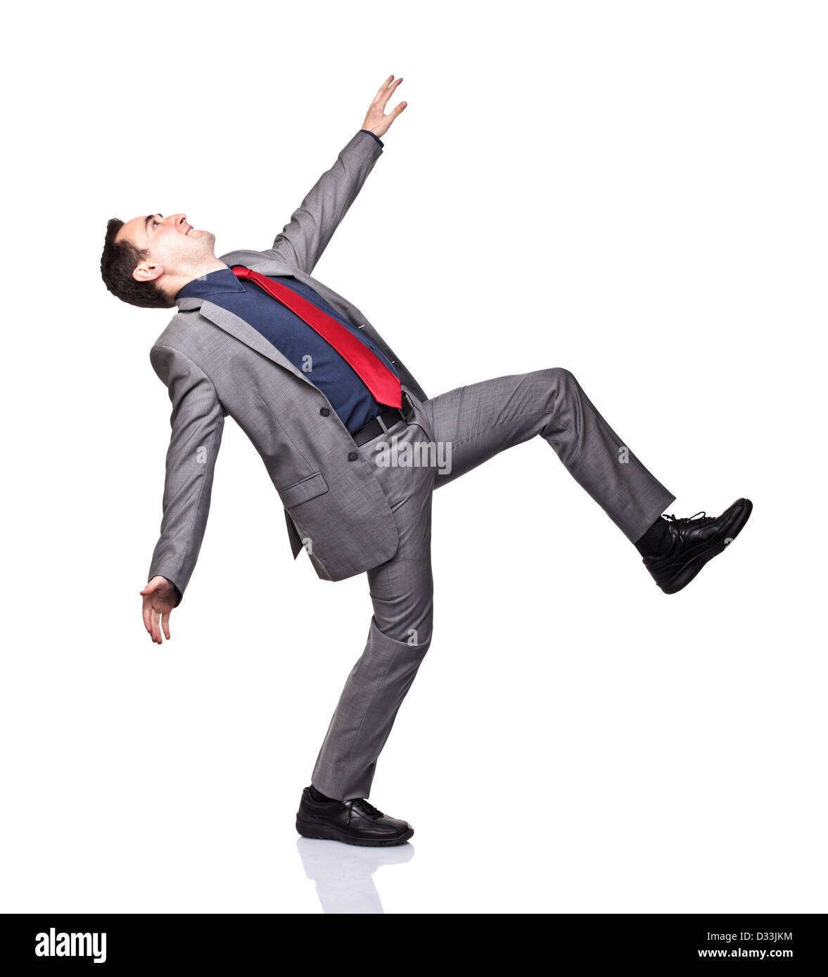 caucasian man near to fall on white background Stock Photo
