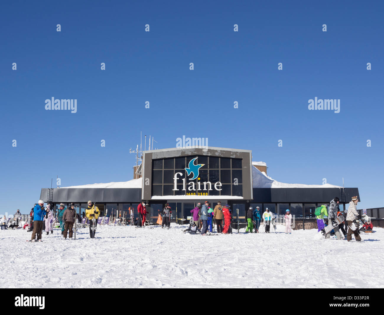 Les Grandes Platieres restaurant and gondola top station with skiers in Le Grand Massif ski area of French Alps. Flaine France Stock Photo