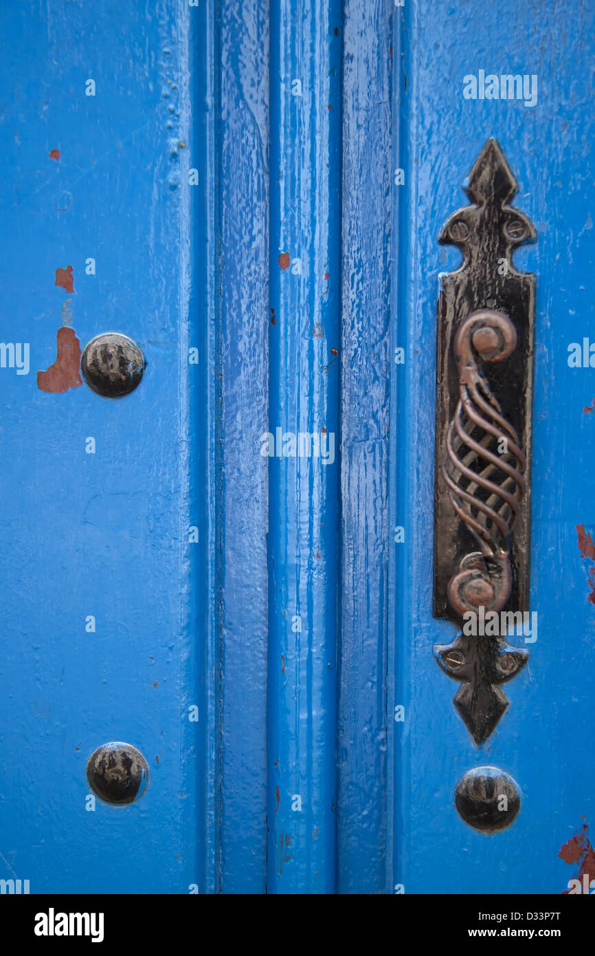 Wooden door painted in blue . Stock Photo