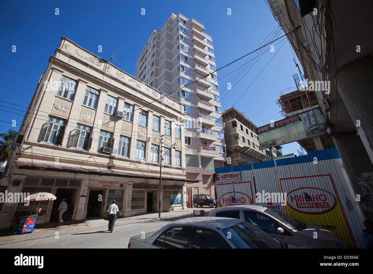 1930's indian building with new high rise in background, Dar es Salaam, Tanzania. Stock Photo