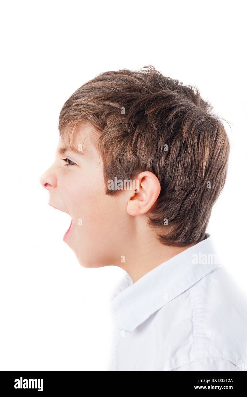 European boy in the white shirt in profile, screaming Stock Photo