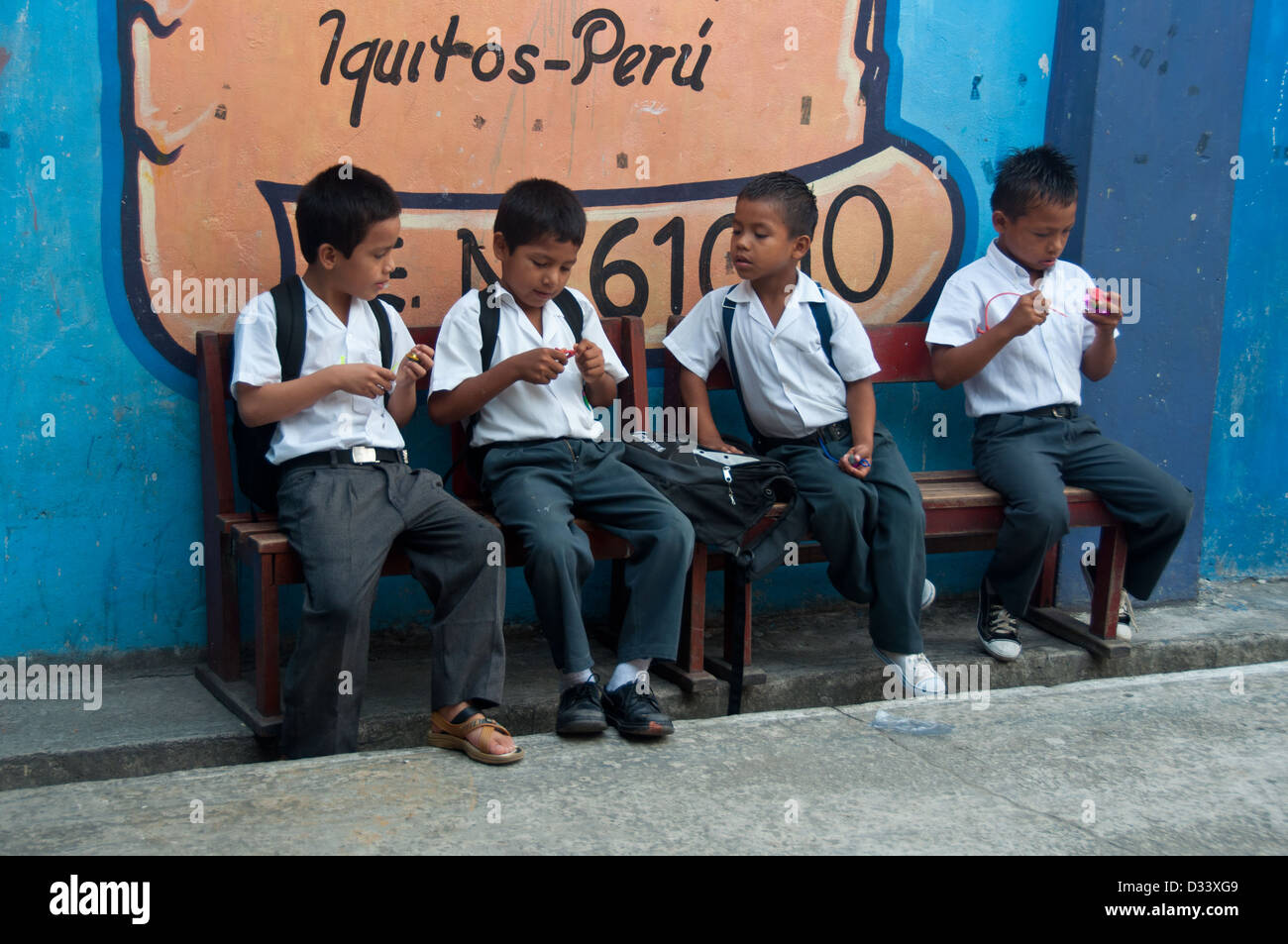 Four kids waiting  school lessons to begin, Iquitos, Peru Stock Photo