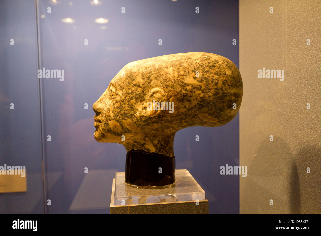 Female head, ancient Egyptian statue. Egyptian stone sculpture shows