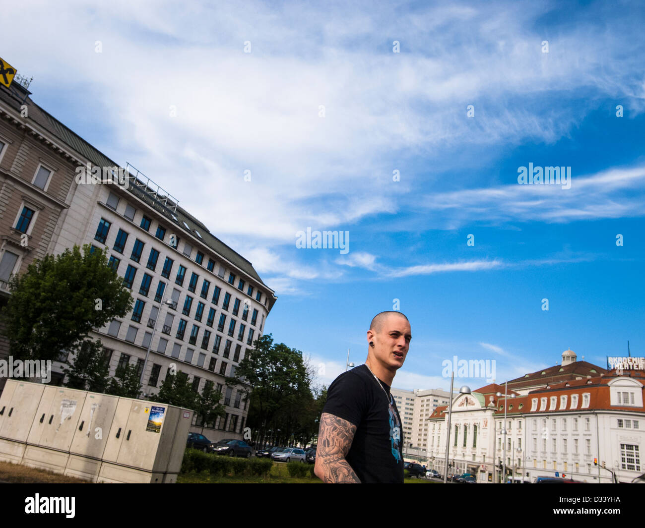 Skinhead with tattoo on his arm Stock Photo