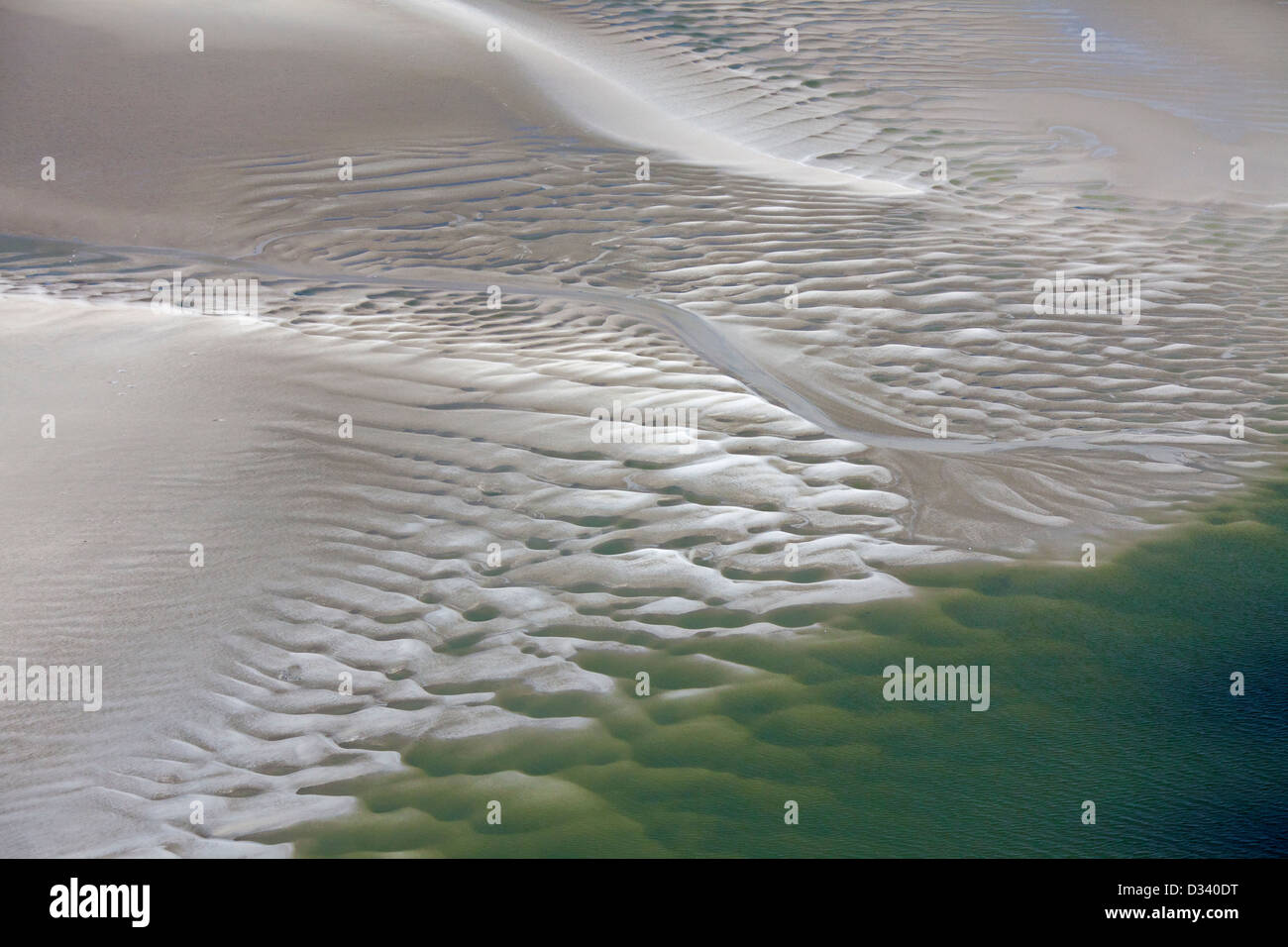 Aerial view over tidal mudflats of the Wadden Sea National Park, North Frisia, Schleswig-Holstein, Germany Stock Photo