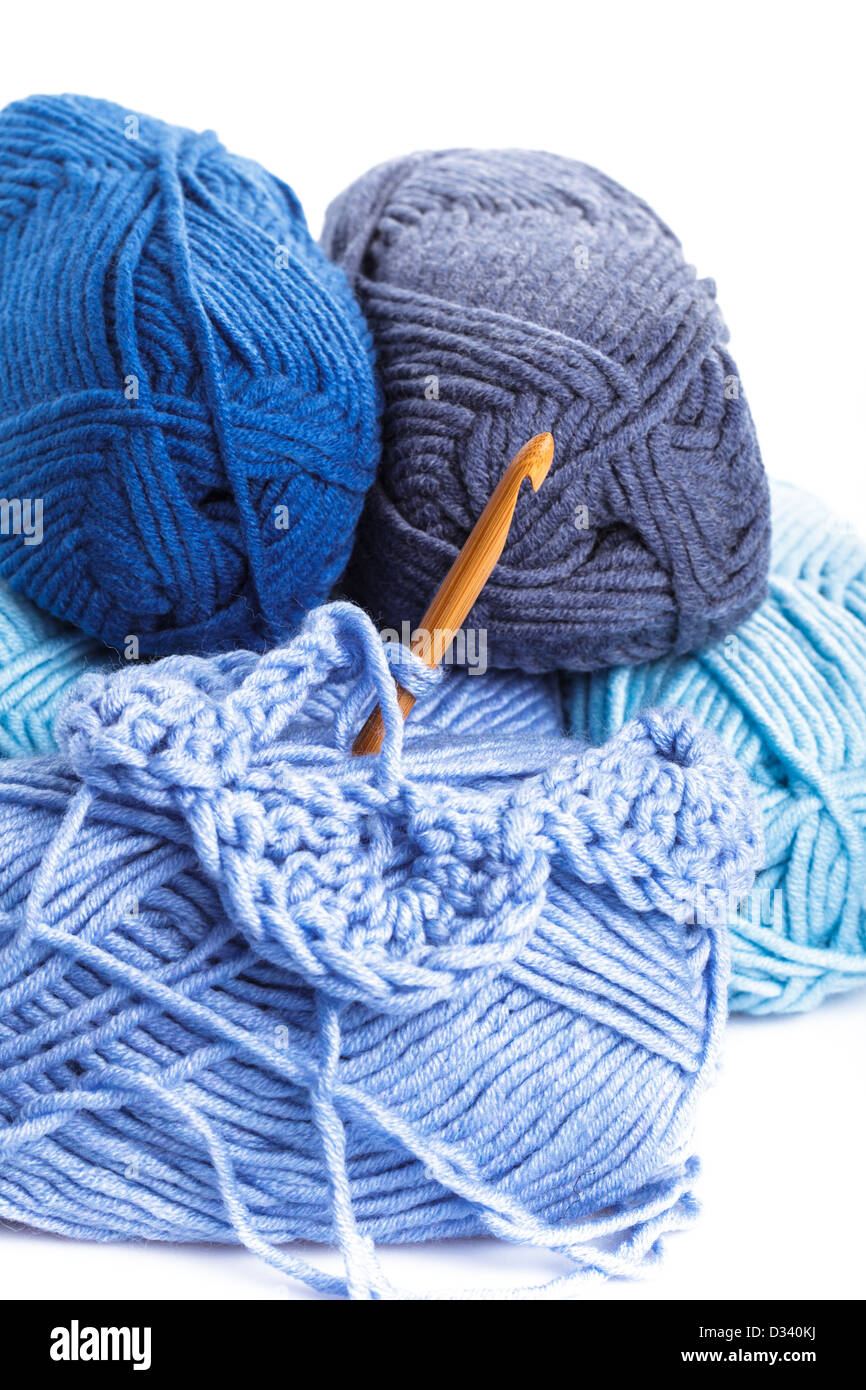 Crocheting pattern with blue a balls of yarn closeup Stock Photo Alamy