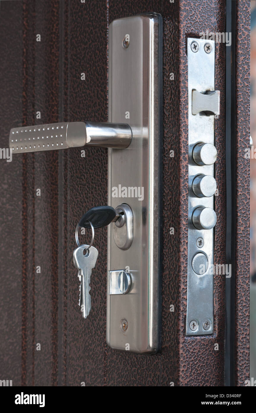 Door lock with keys in situation it is closed Stock Photo - Alamy