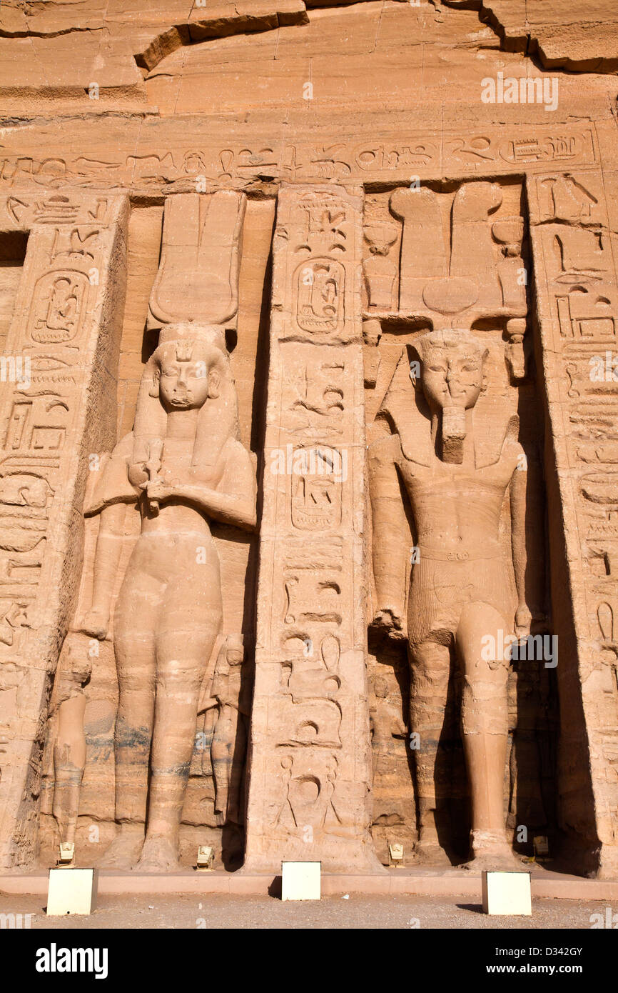 Statues of queen Nefertari and pharaoh Ramesses II on the outer facade of the Small Temple of Hathor at Abu Simbel, Egypt Stock Photo
