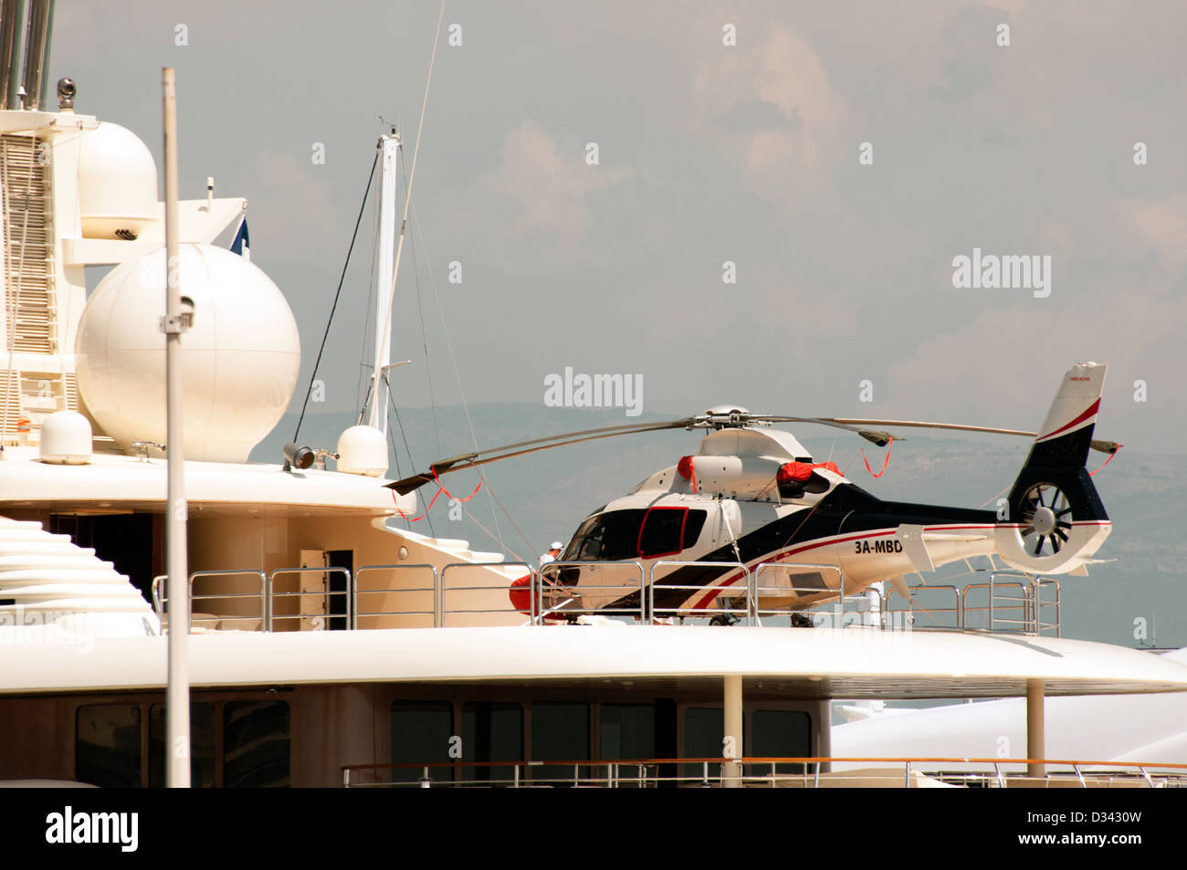 Helicopter landing on a luxurious yacht in Antibes French Riviera France Stock Photo
