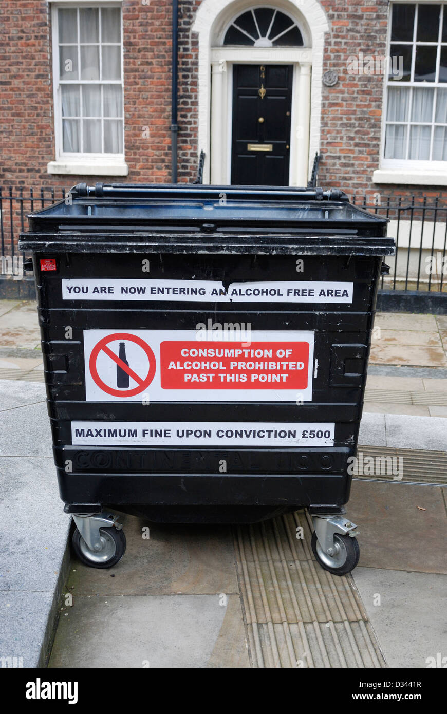 Wheelie bin covered with warning signs stating it is an alcohol free area - outside Liverpool Beer Festival! Stock Photo