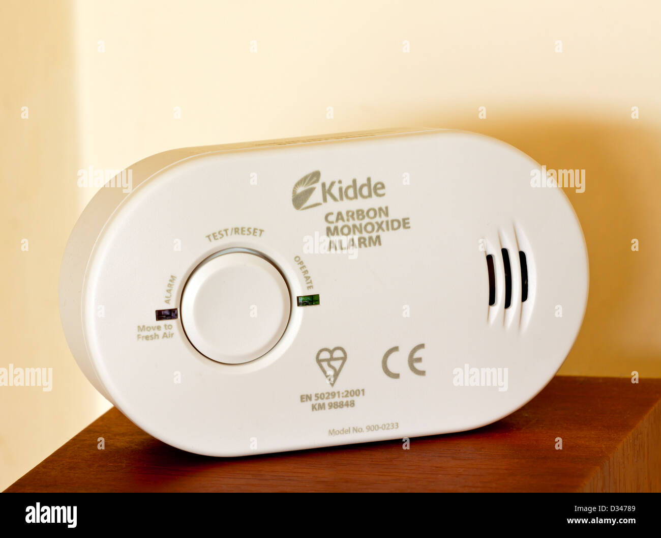 Domestic carbon monoxide alarm used in homes to detect the dangerous gas before causing poisoning or death Stock Photo