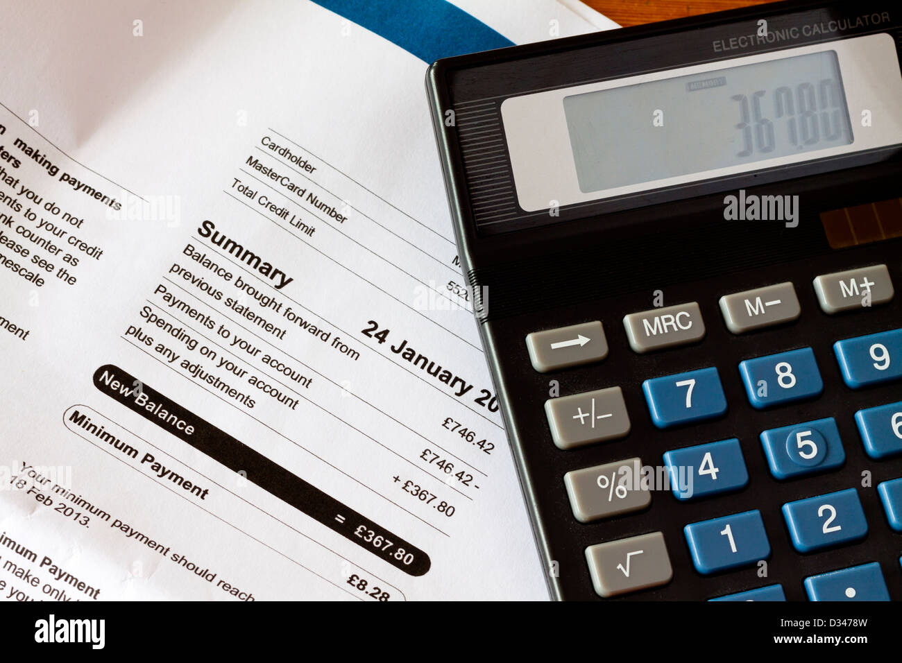 UK credit card bill with electronic calculator Stock Photo