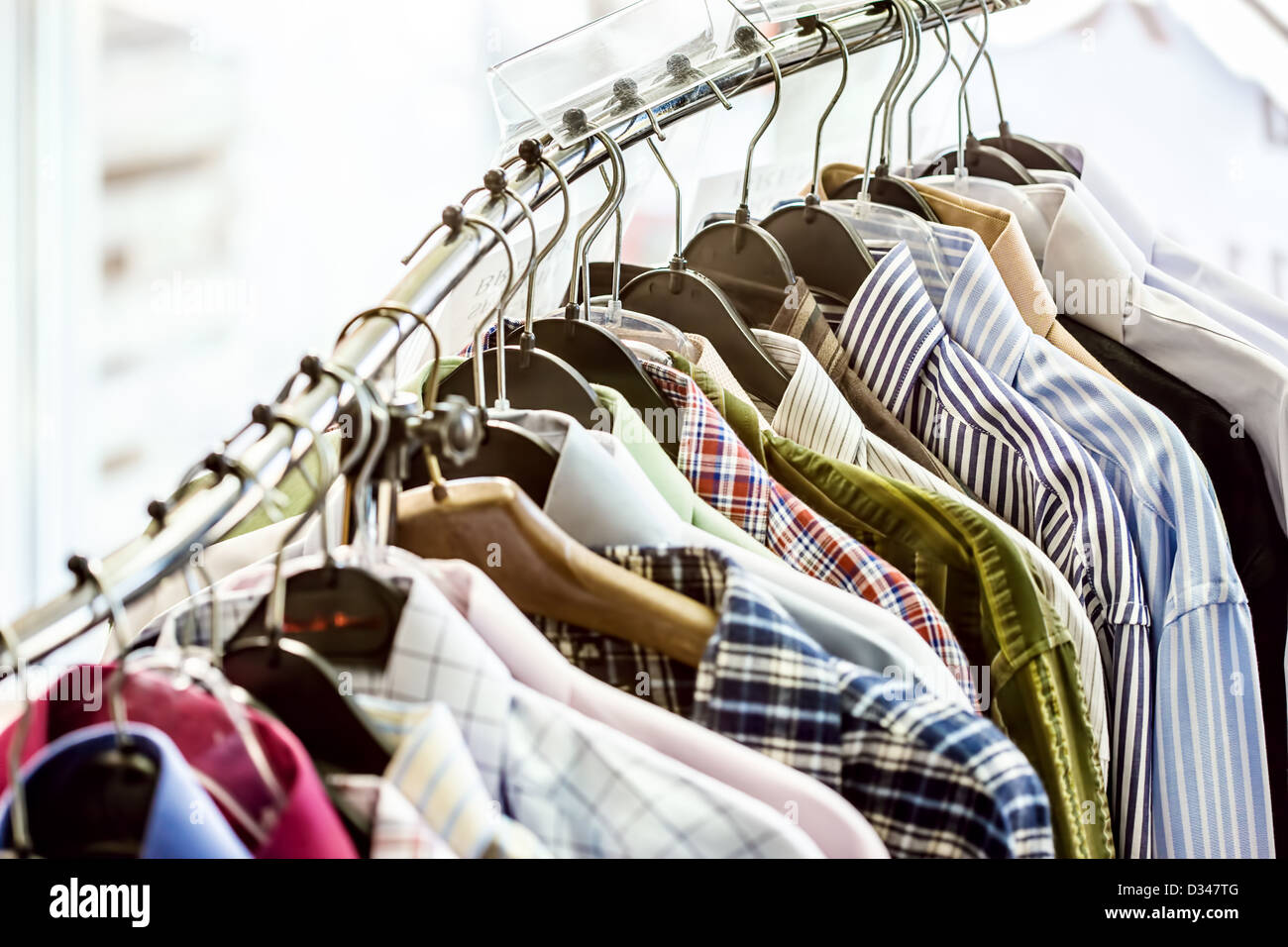 Shirts on hangers in the store Stock Photo Alamy