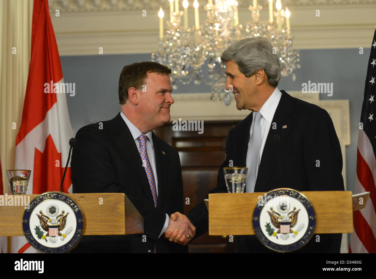Washington DC, USA. 8th February 2013. US Secretary of State John Kerry shakes hands with Canadian Foreign Minister John Baird after their joint press conference at the Department of State February 8, 2013 in Washington, DC. Credit:  US State Department / Alamy Live News Stock Photo