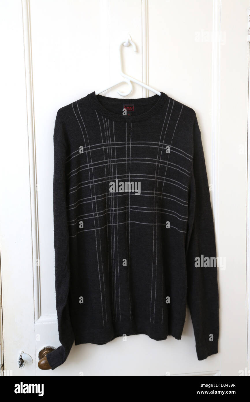 Black Jumper Hanging On Door Stock Photo Alamy