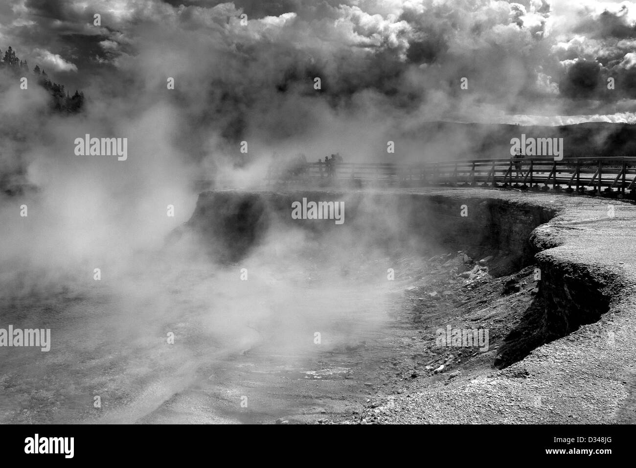 Steam rises from Excelsior Geyser Crater in the Grand Prismatic Spring area of Wyoming's Yellowstone National Park Stock Photo