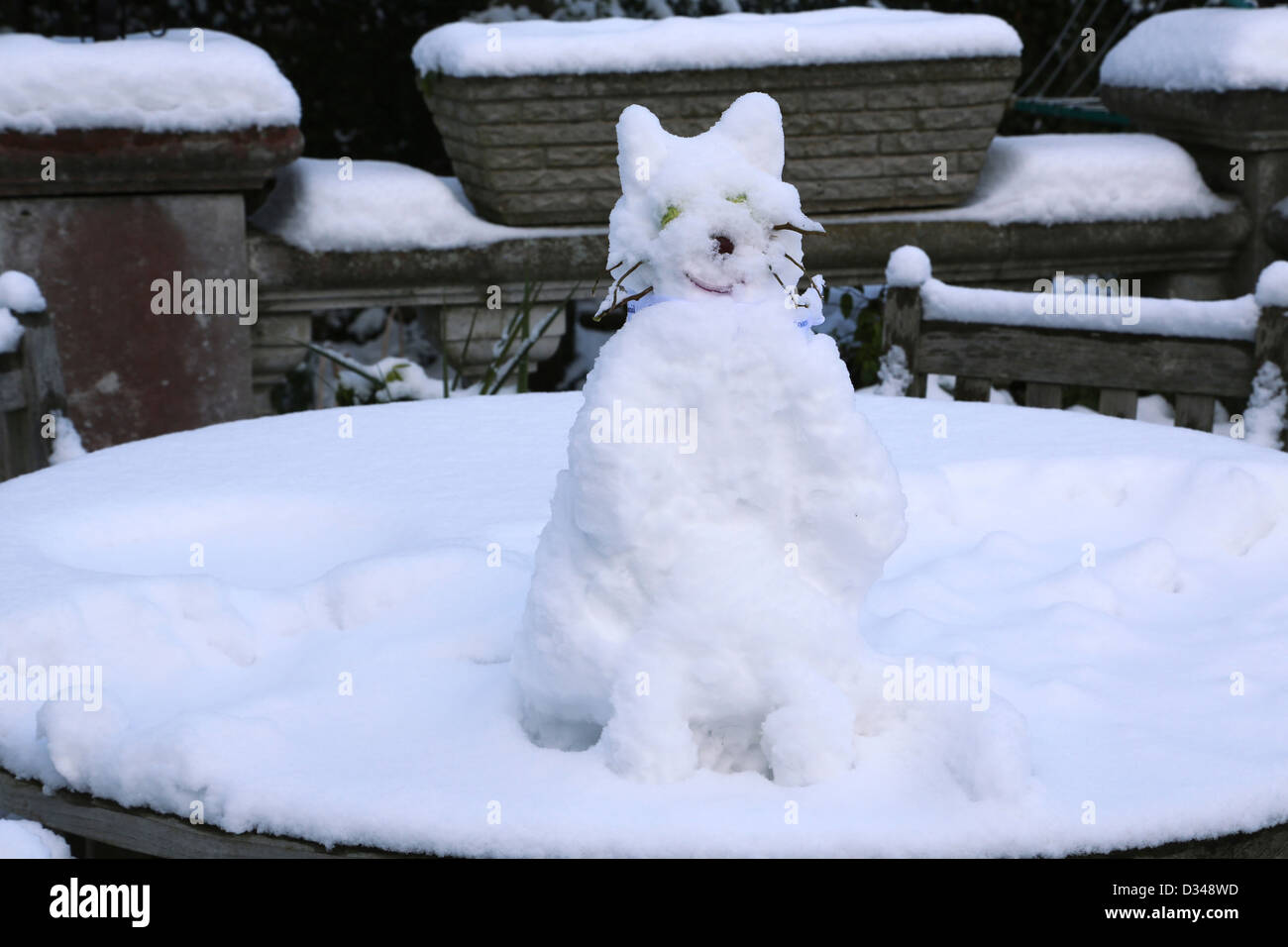 Snowcat With Brussel Sprouts For Eyes, A Grape For A Nose And Twigs For Whiskers On Garden Table Surrey England Stock Photo