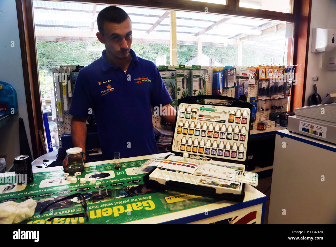 Man With Water Testing Kit In Maidenhead Aquatics Shop England Stock Photo