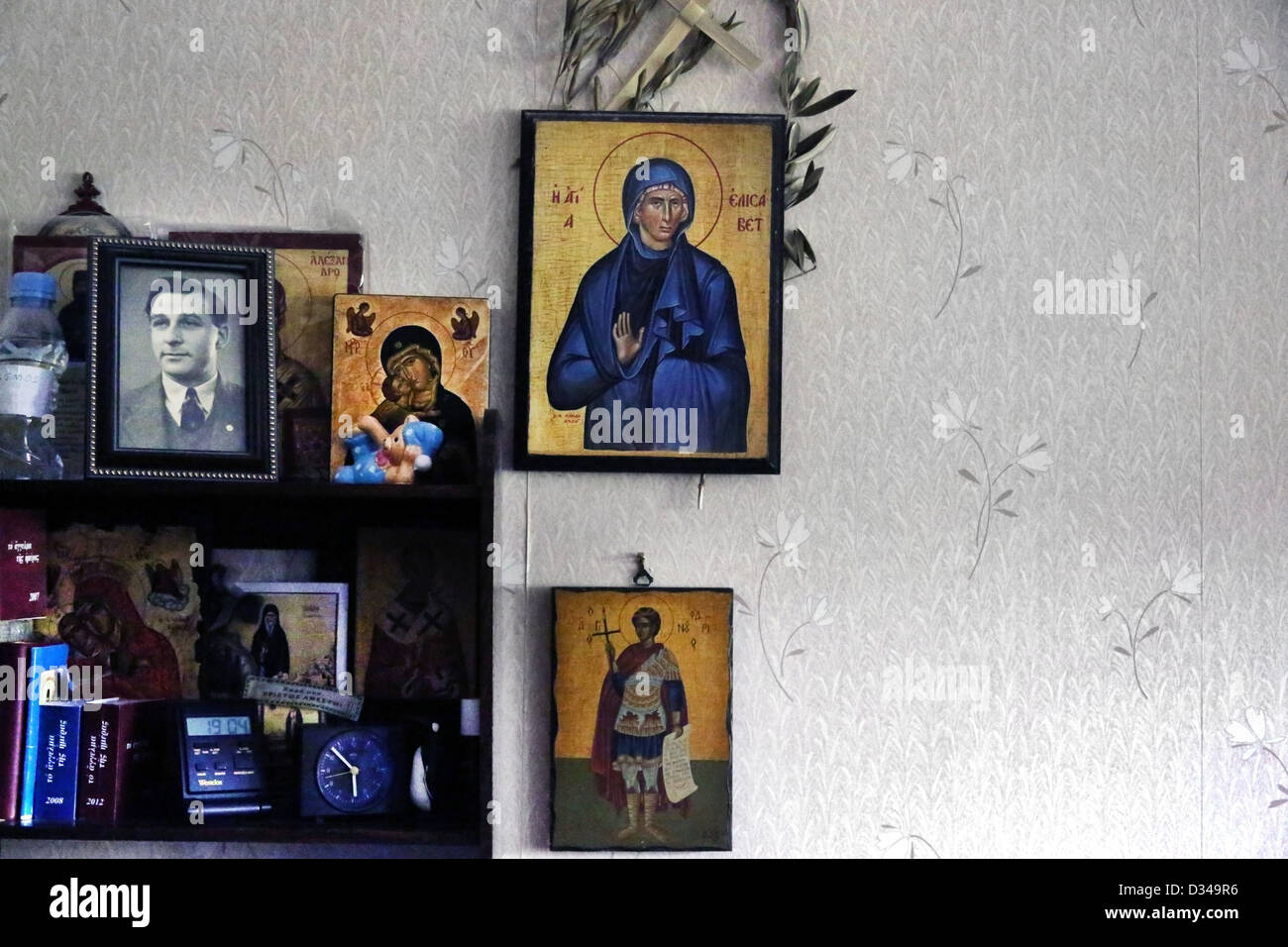 Greek Orthodox Icons On Shelves And Saint Elizabeth Hanging On The Wall With Olive Branch Stock Photo