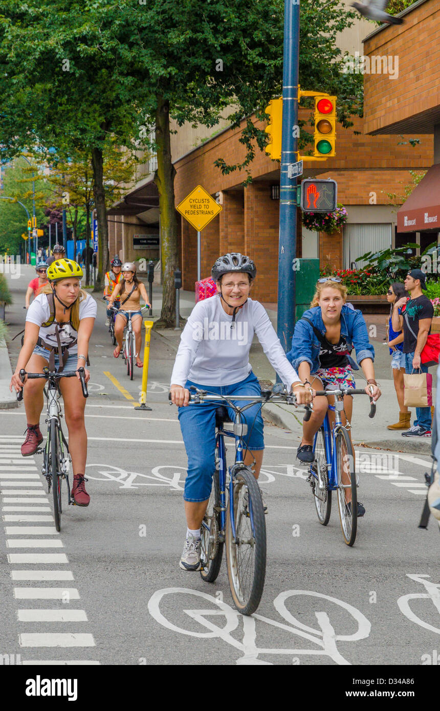 Cyclists on dedicated bike bicycle lane , Vancouver, British Columbia, Canada Stock Photo