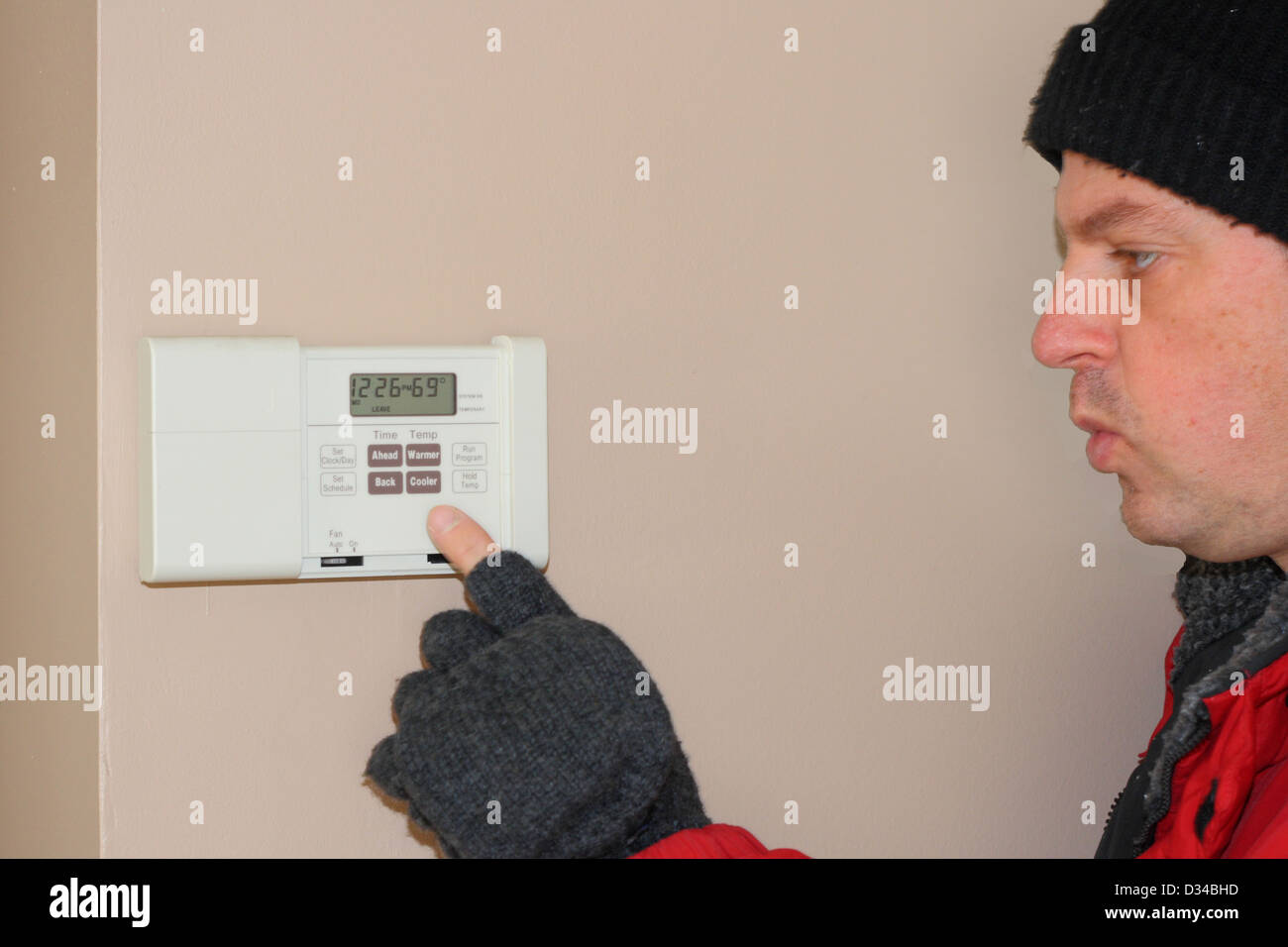 home thermostat showing importance of furnace maintenance to avoid breakdown Stock Photo