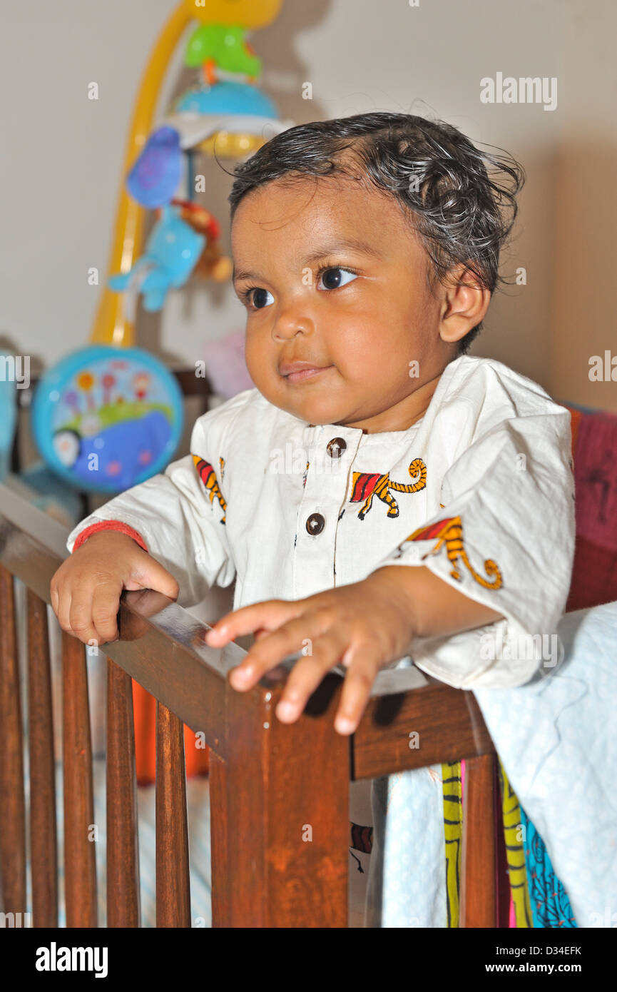 Indian Baby Girl Playing In Her Wooden Crib Stock Photo 53574295