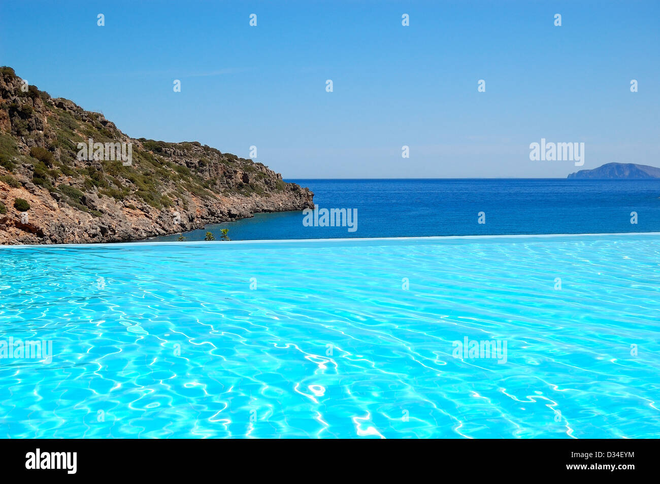 Infinity swimming pool with a view on Aegean Sea at the luxury hotel, Crete, Greece Stock Photo