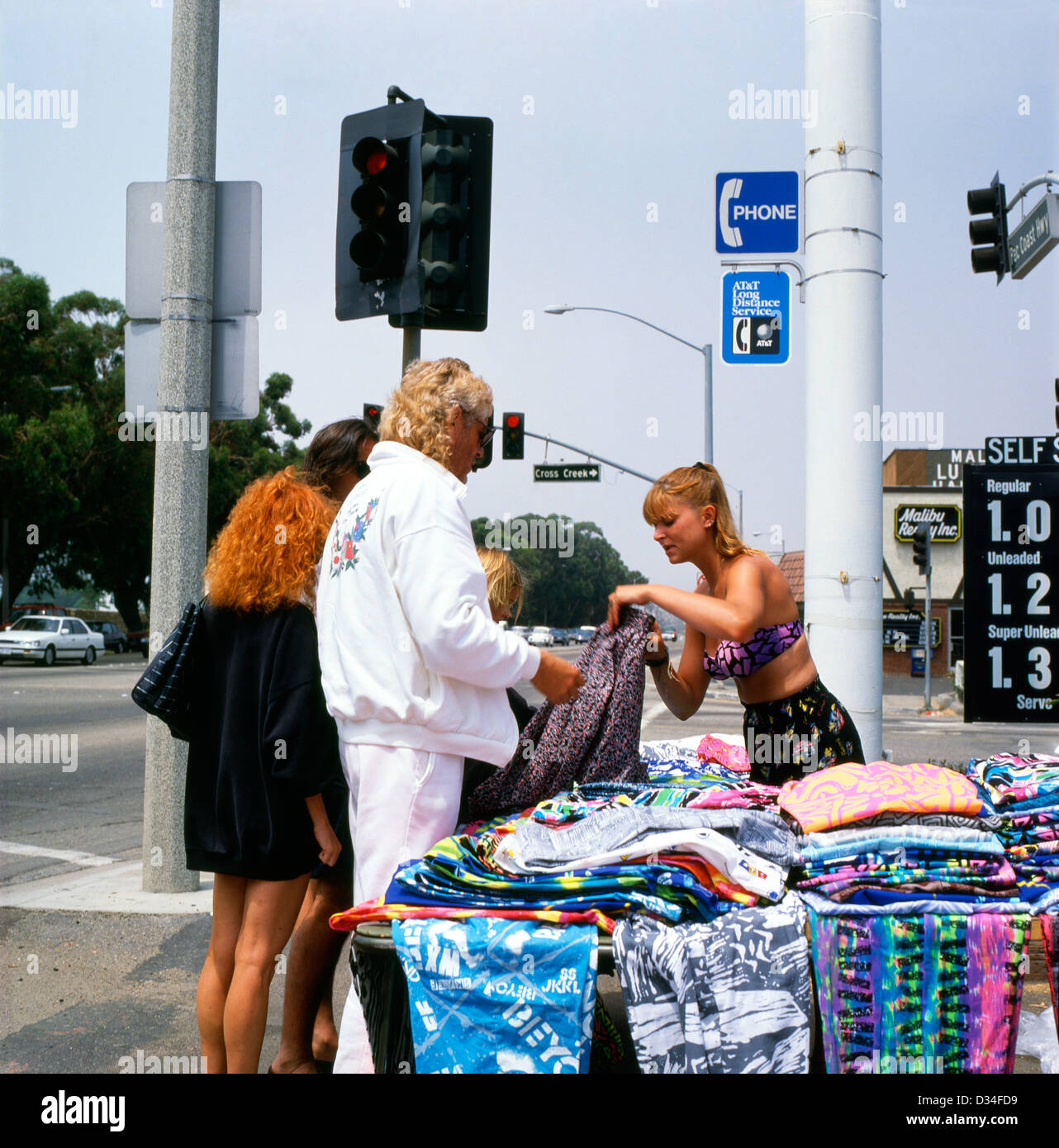 People buying homemade trousers at a market stall on the Pacific Coast Highway PCH in Malibu Los Angeles California 1980s 1990s 80s 90s  KATHY DEWITT Stock Photo