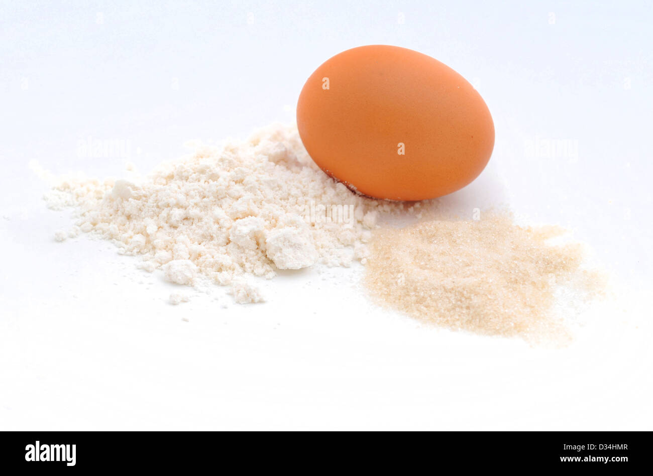 raw ingredients for baking which consists of an egg, flour and sugar Stock Photo