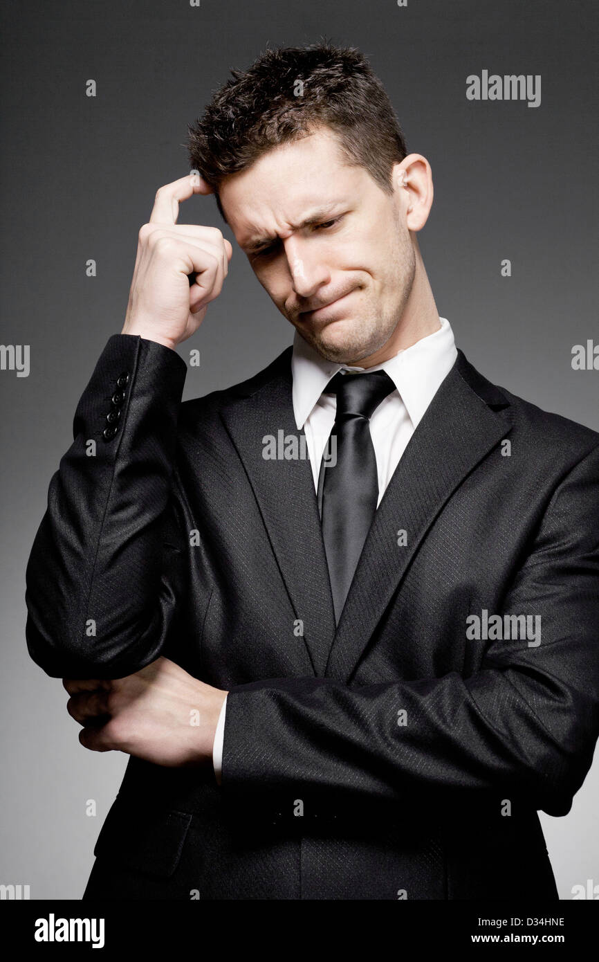 Young handsome business man in white shirt and black suit Stock Photo ...