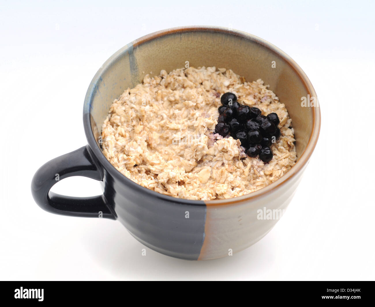 Blueberries and oatmeal for a snack or breakfast Stock Photo