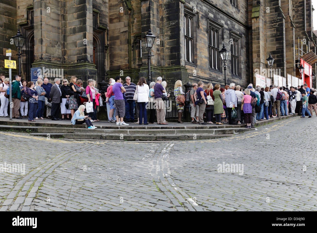 People queuing at the Assembly Hall venue on Mound Place during the Edinburgh Festival Fringe, Scotland, UK Stock Photo