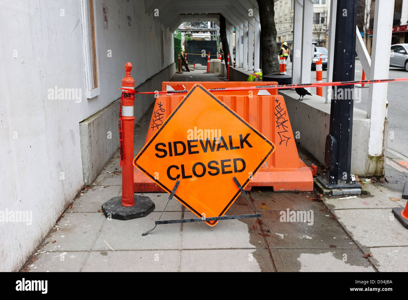 temporary sidewalk closed signs at construction site in downtown Vancouver BC Canada Stock Photo