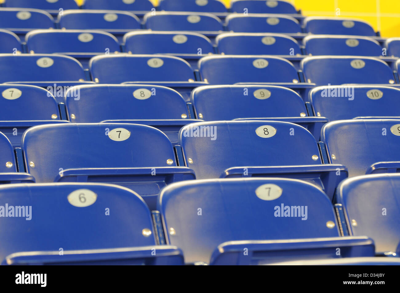 rows of blue chairs at sporst stadium Stock Photo